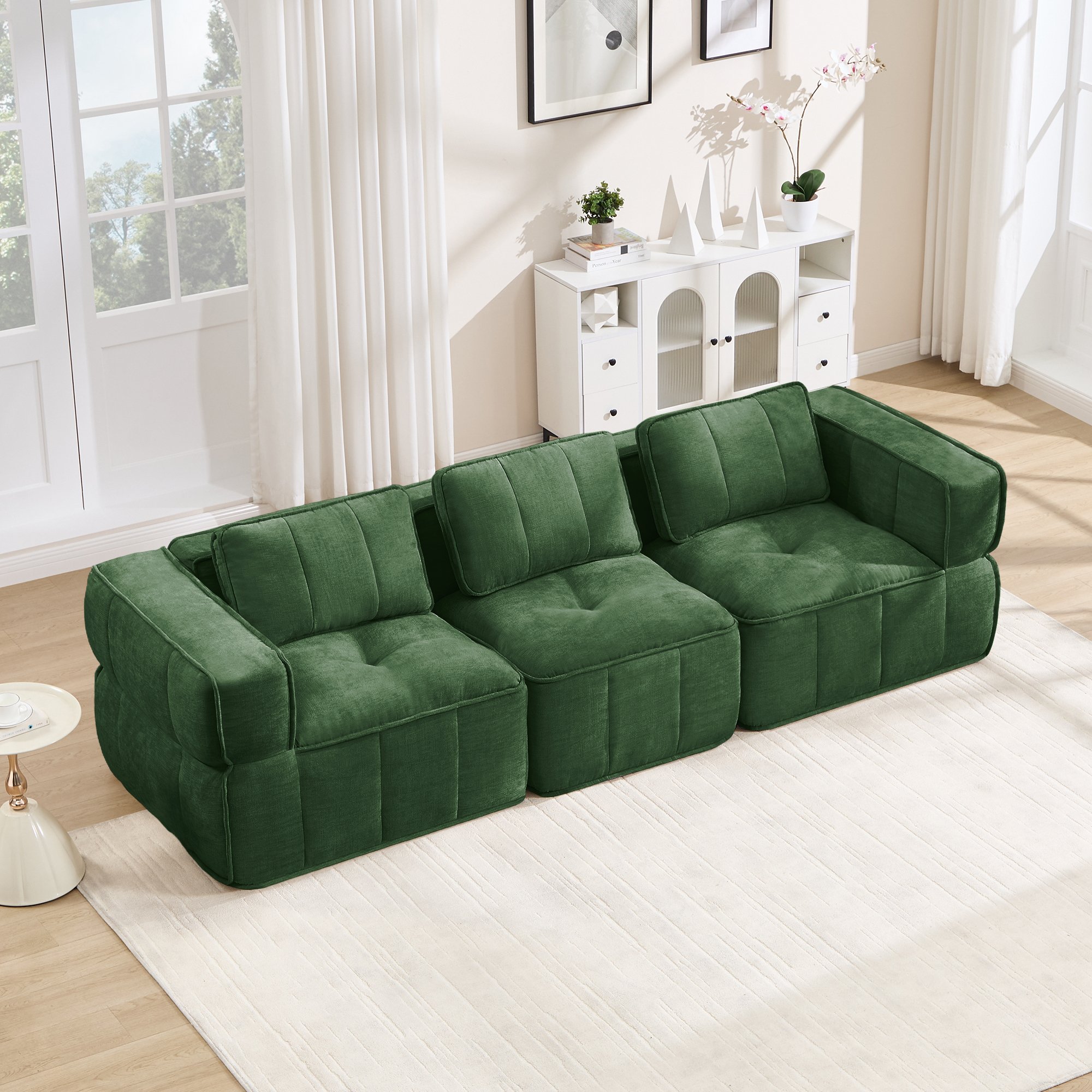 Canapé modulable 3 places vert en tissu polyester, design sans pieds, mousse haute densité 32D, dimensions 271x93x67 cm, aucun montage requis pour le salon.