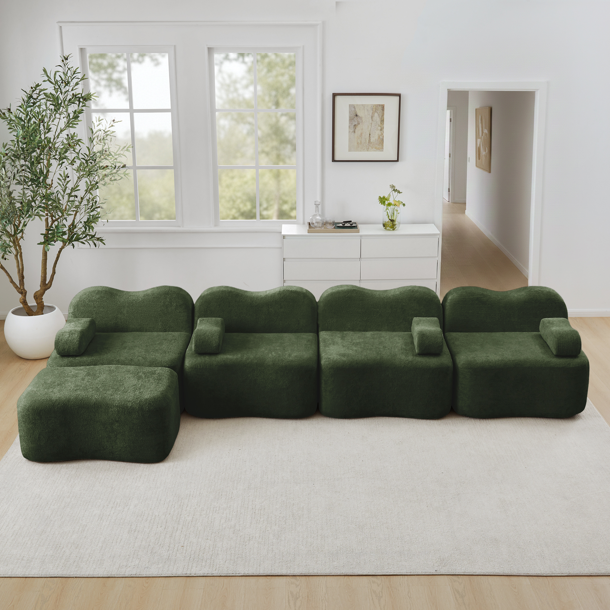 Canapé d'angle modulable 4 places en velours vert, structure sans dossier avec coffre de rangement intégré et ottoman pour salon moderne