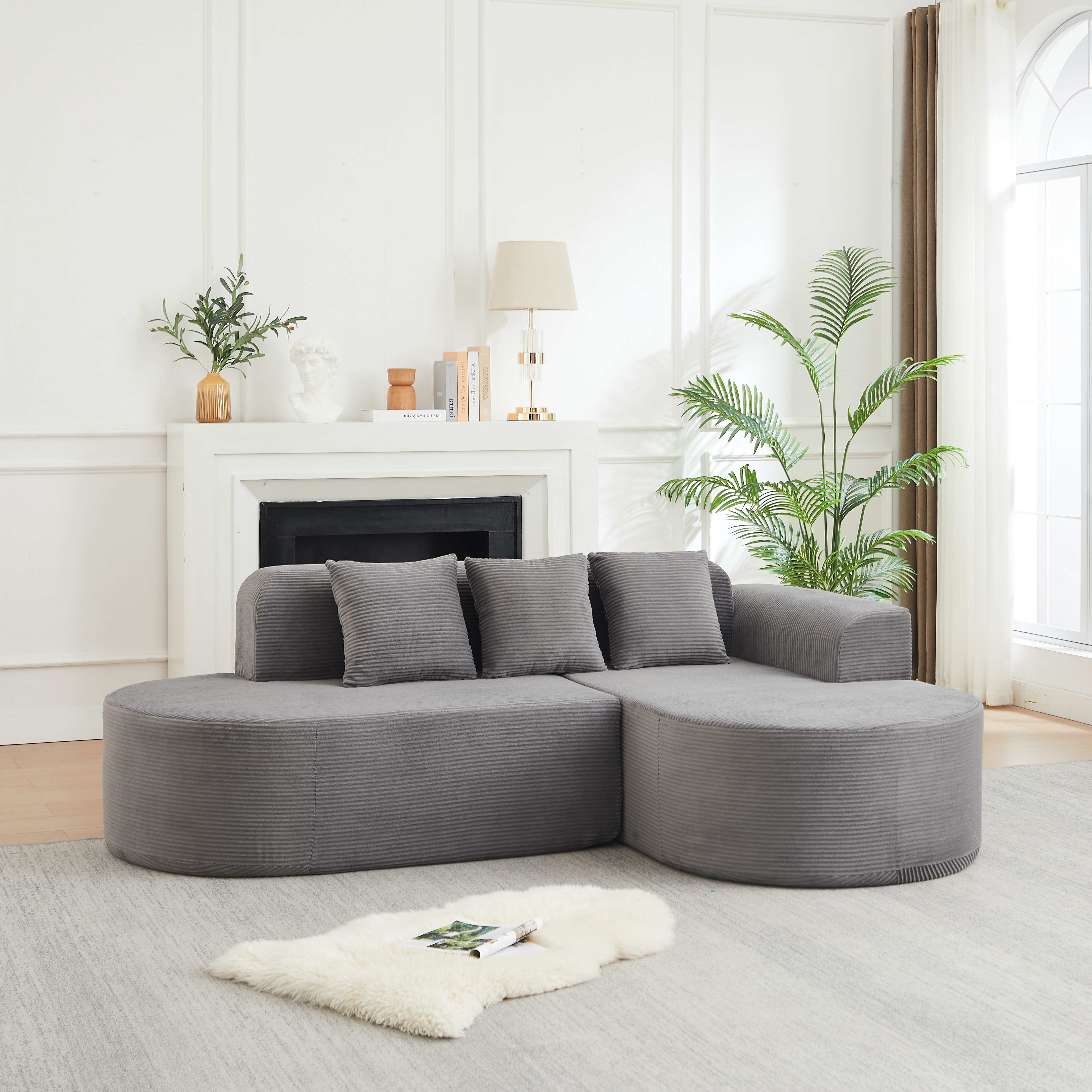 Canapé d'angle 220x155cm en velours côtelé gris, design courbe avec coussins inclus, structure mousse et ressorts pour salon moderne