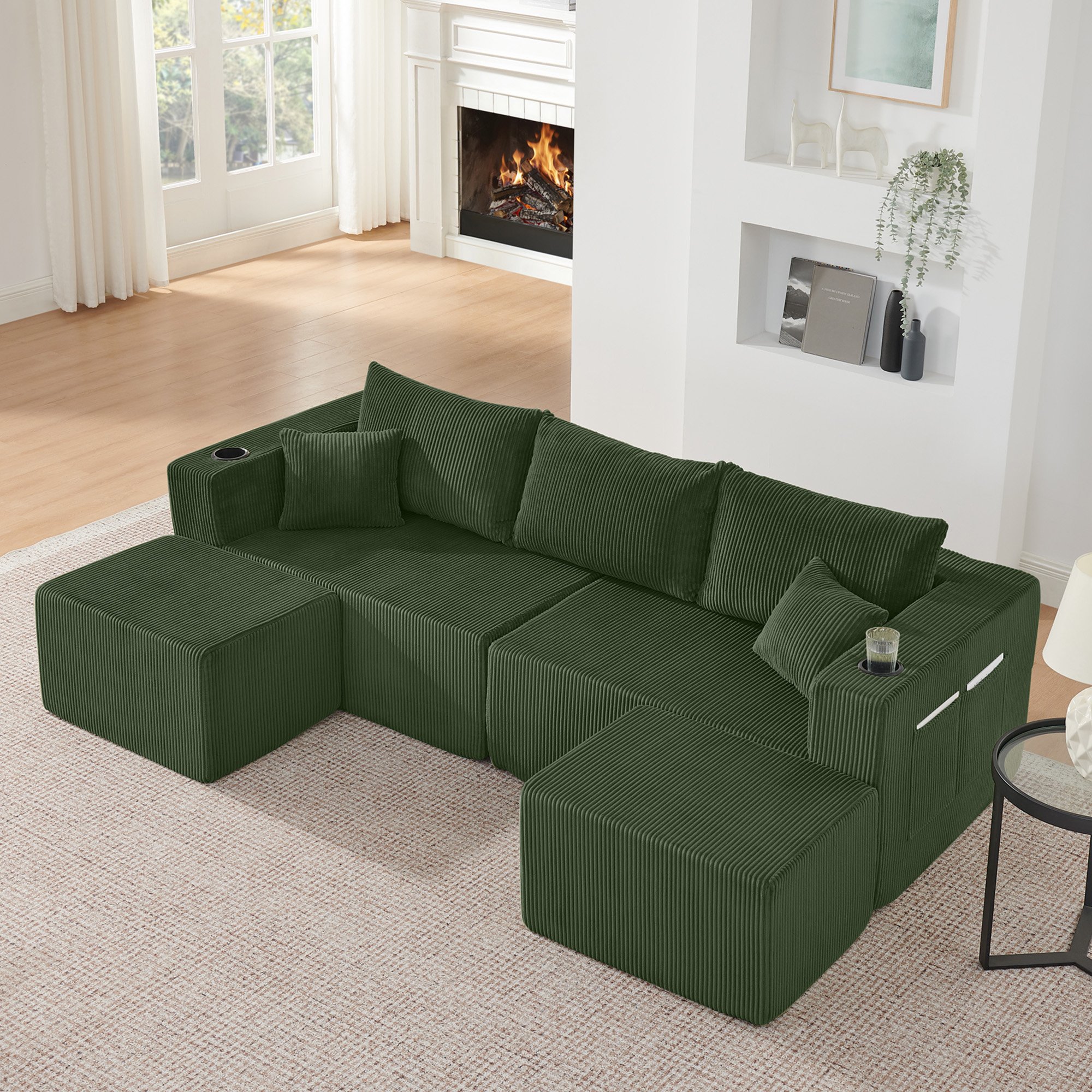 Canapé d'angle modulable 3 places vert en tissu côtelé avec poufs mobiles, porte-gobelets intégrés et poches de rangement latérales pour salon moderne