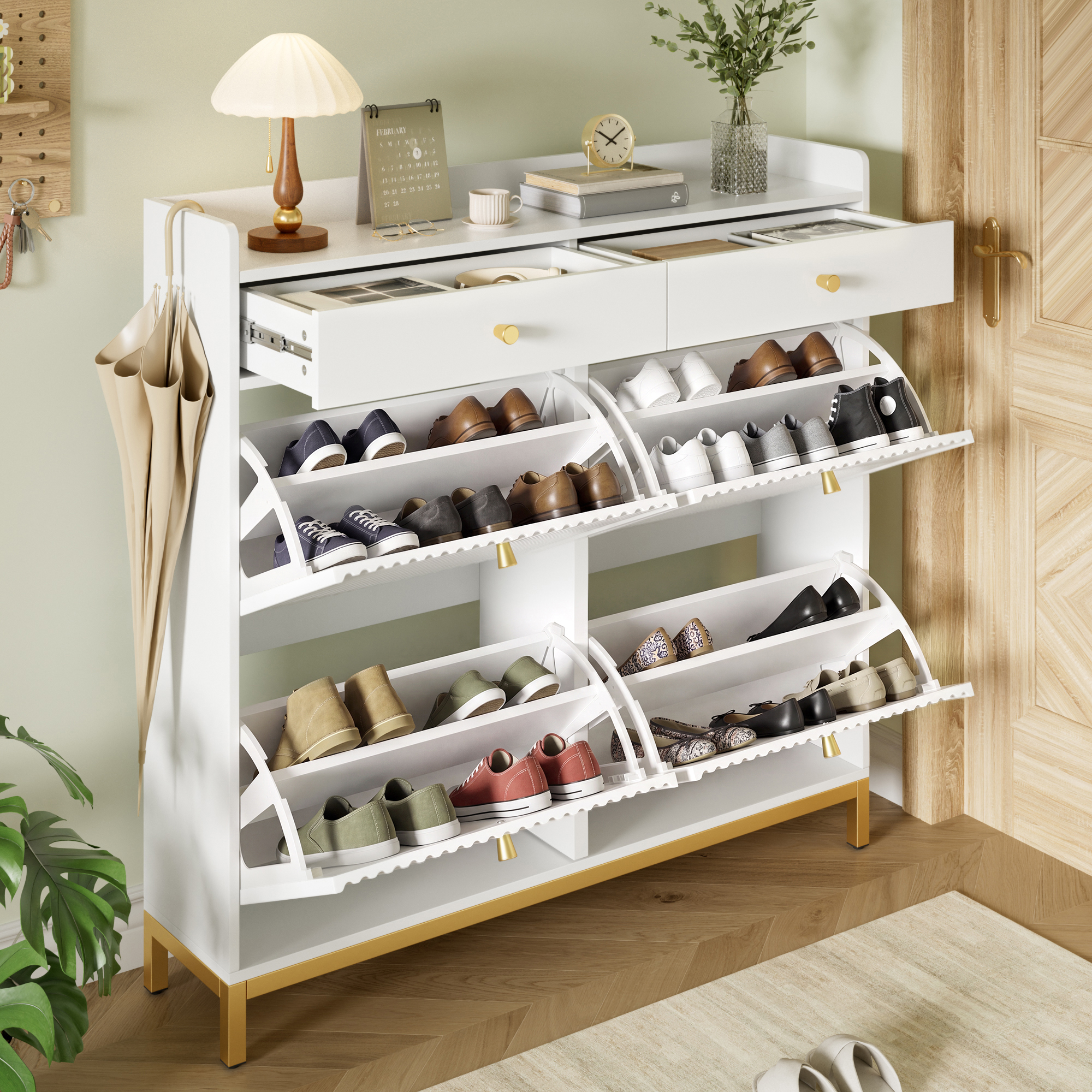 Meuble à chaussures en panneau de particules blanc, pieds et poignées métalliques dorés, structure robuste et design épuré
