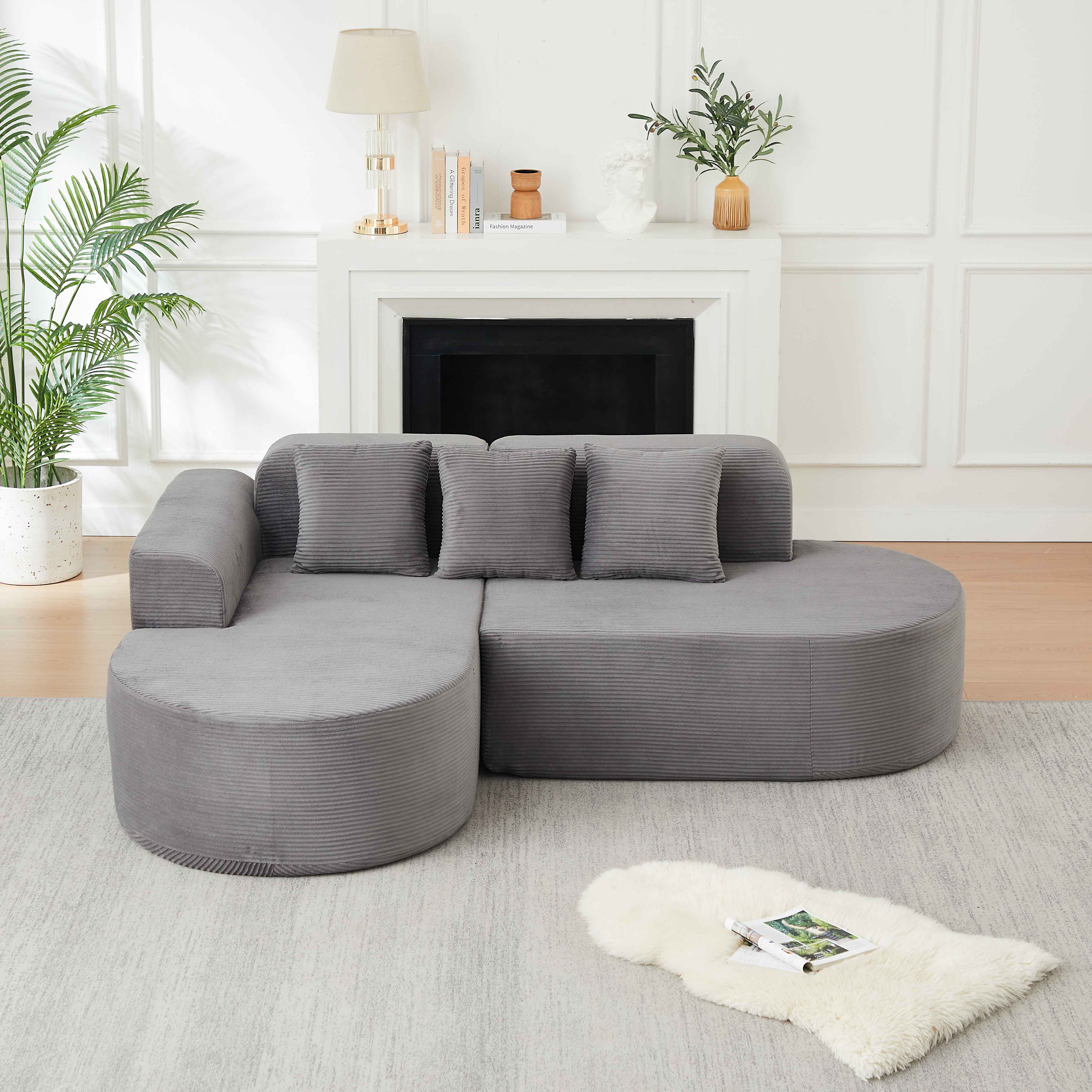 Grand canapé d'angle 220x155cm en velours côtelé gris, format généreux avec dossiers courbes pour espace de vie