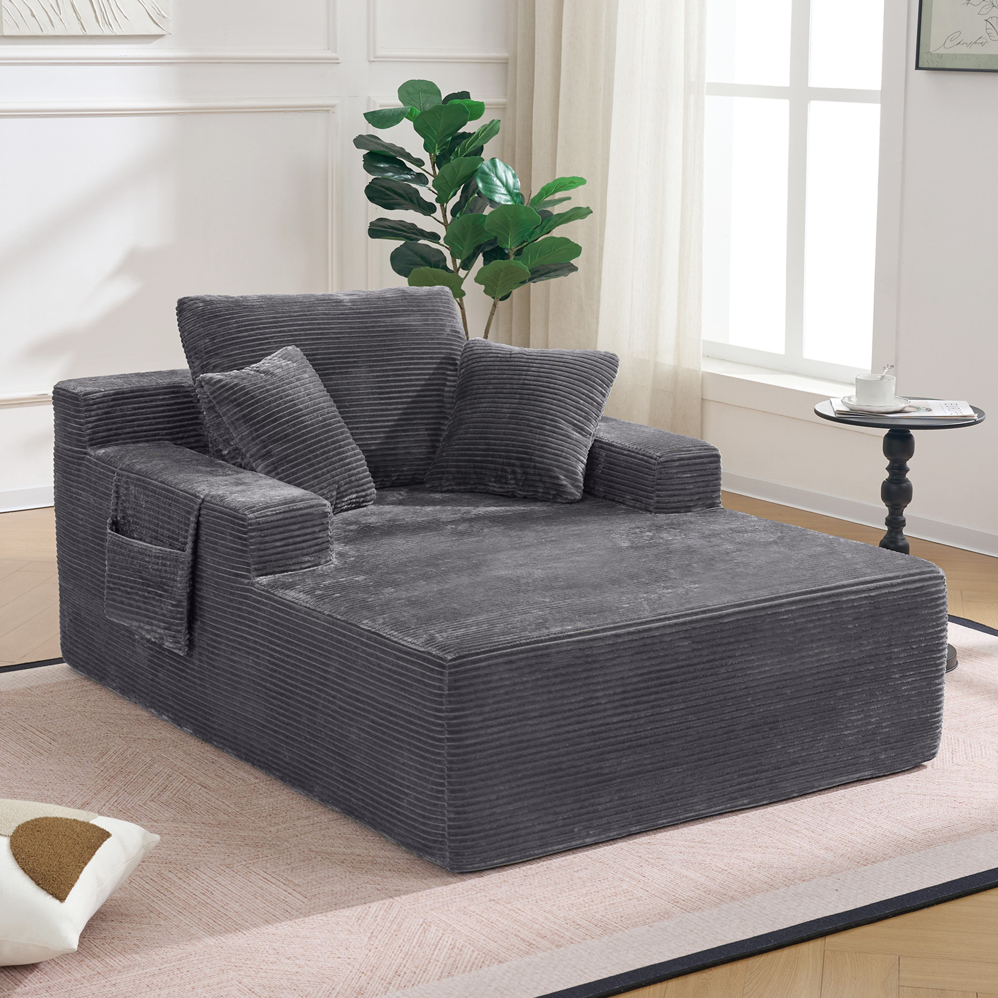 Canapé droit en velours côtelé gris foncé, sans montage requis, avec poches latérales pour télécommande et coussins inclus, style moderne et compact.