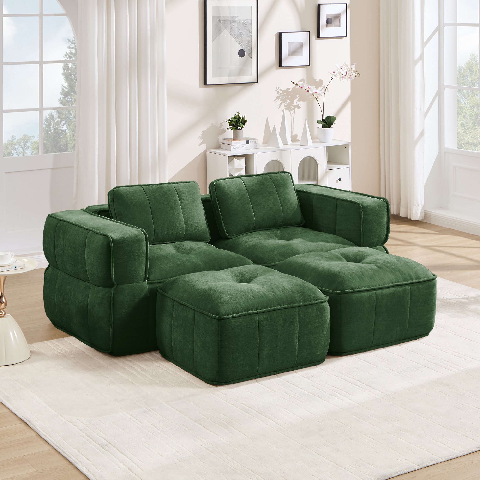 Canapé modulaire 2 places vert en polyester, sans structure, assise profonde et deux poufs inclus, idéal pour le salon moderne
