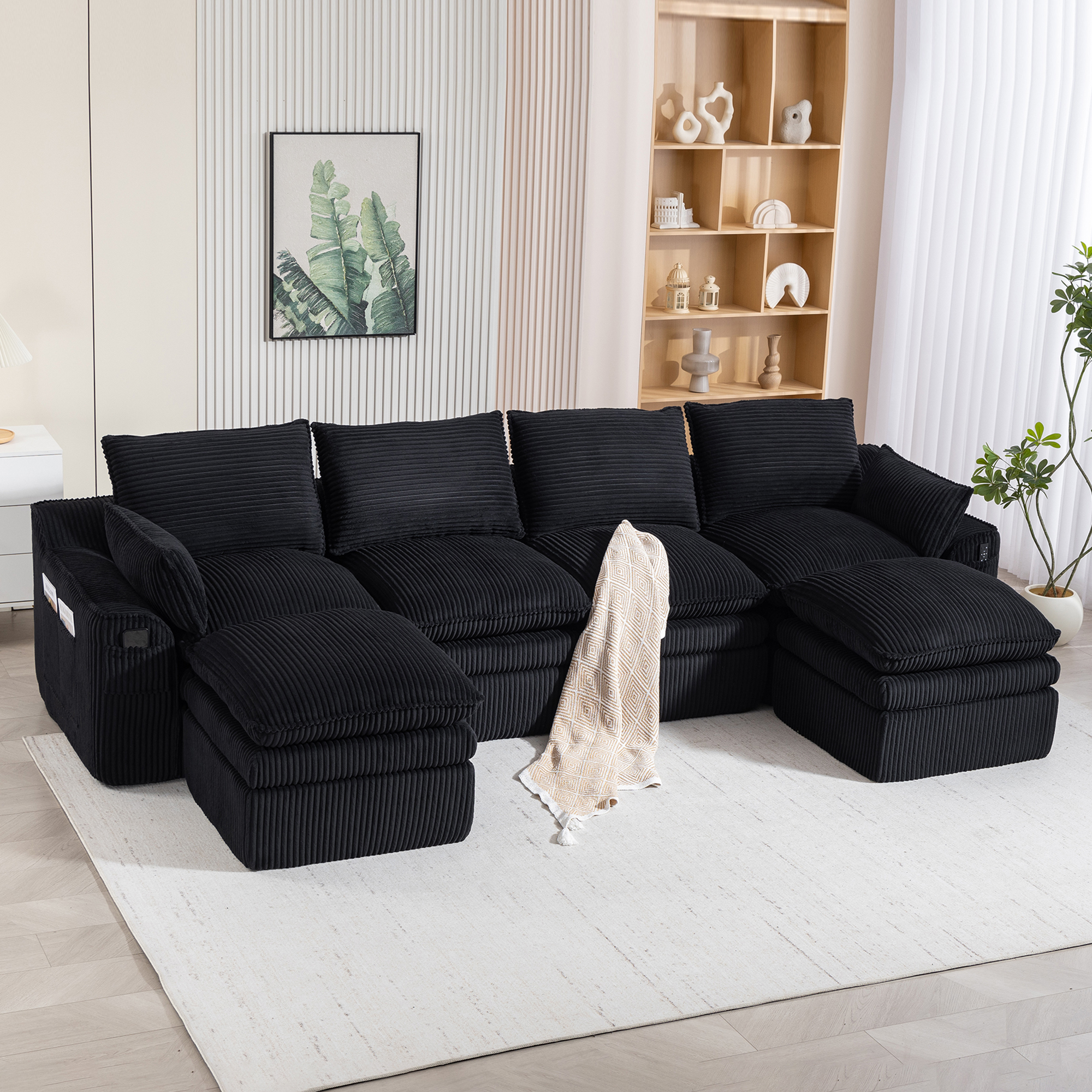 Canapé modulable 4 places en velours côtelé noir avec 2 poufs, coussins et poches latérales