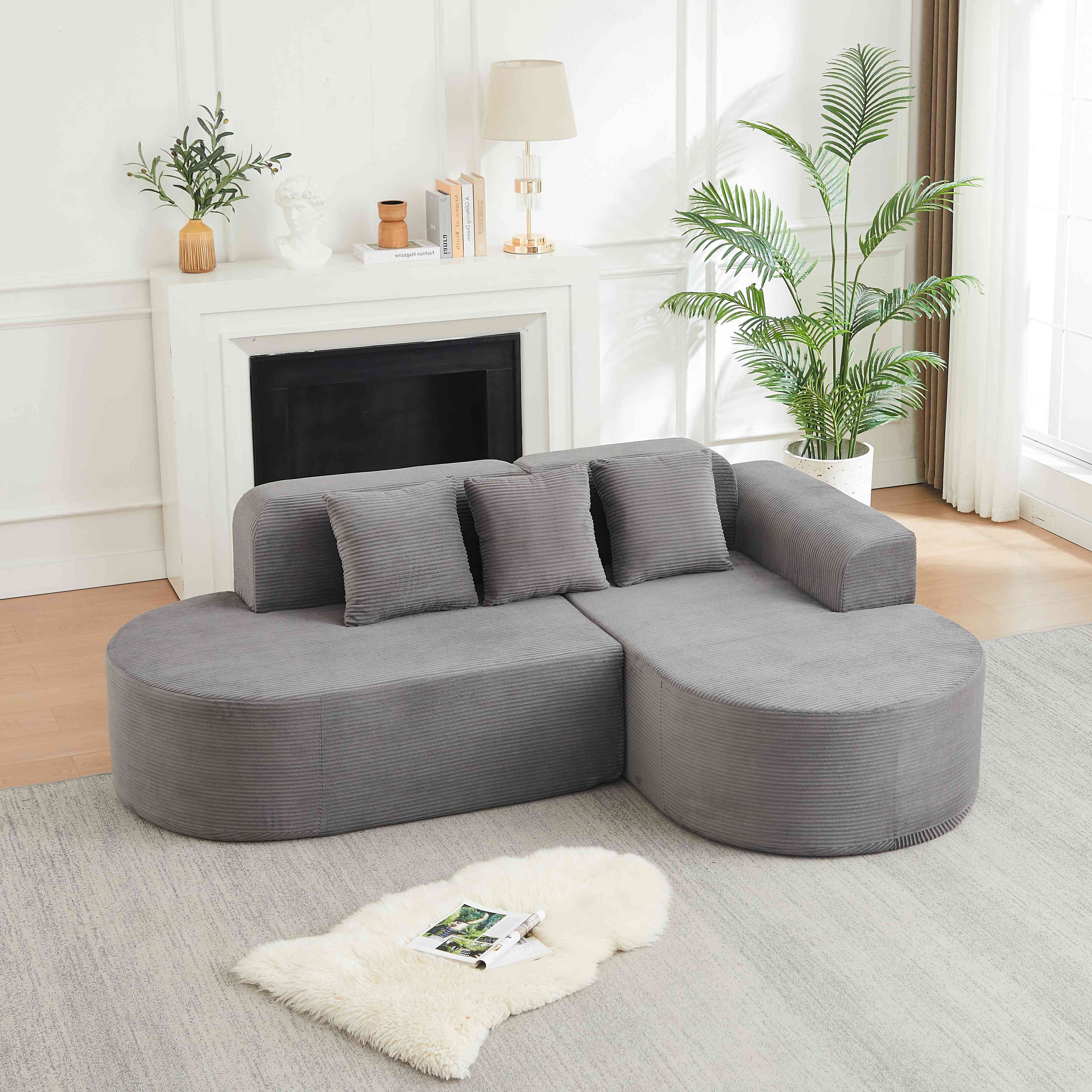 Canapé d'angle 220x155cm en velours côtelé gris, design courbe avec coussins inclus, structure mousse et ressorts pour salon moderne