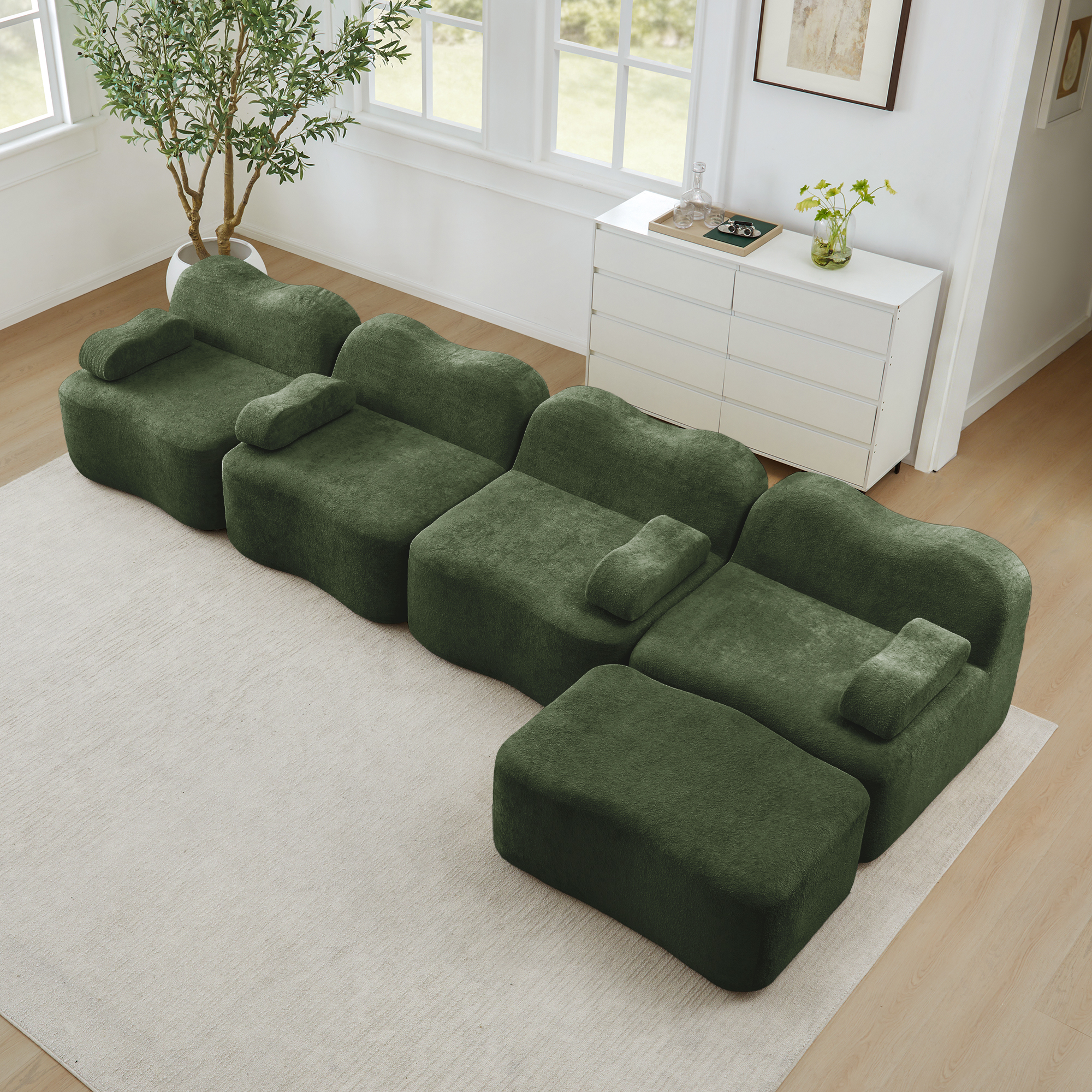 Canapé d'angle modulable 4 places en velours vert, structure sans dossier avec coffre de rangement intégré et ottoman pour salon moderne