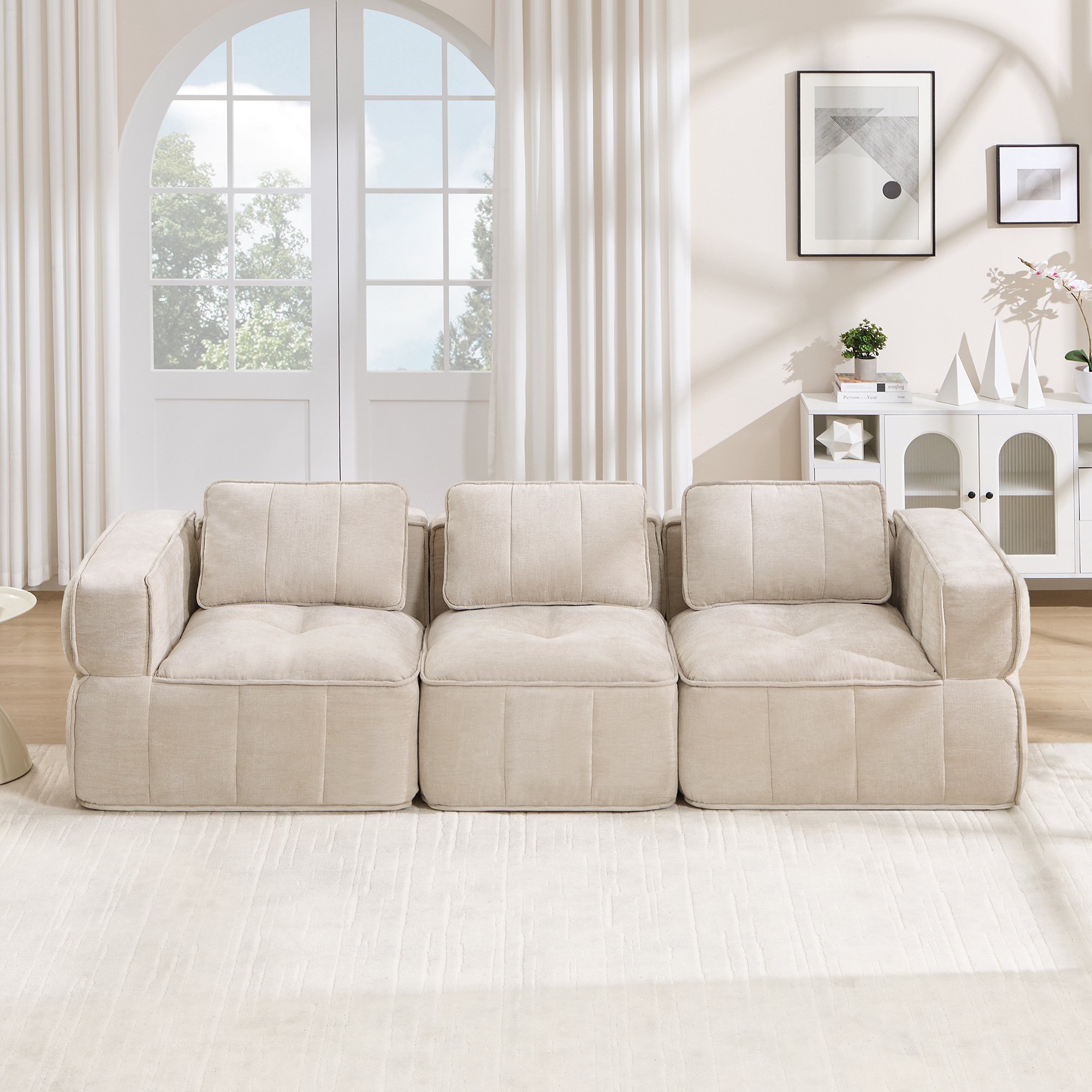 Canapé modulable 3 places beige en tissu polyester, design sans cadre avec mousse haute densité, dimensions 271x93x67 cm pour salon moderne et usage immédiat.