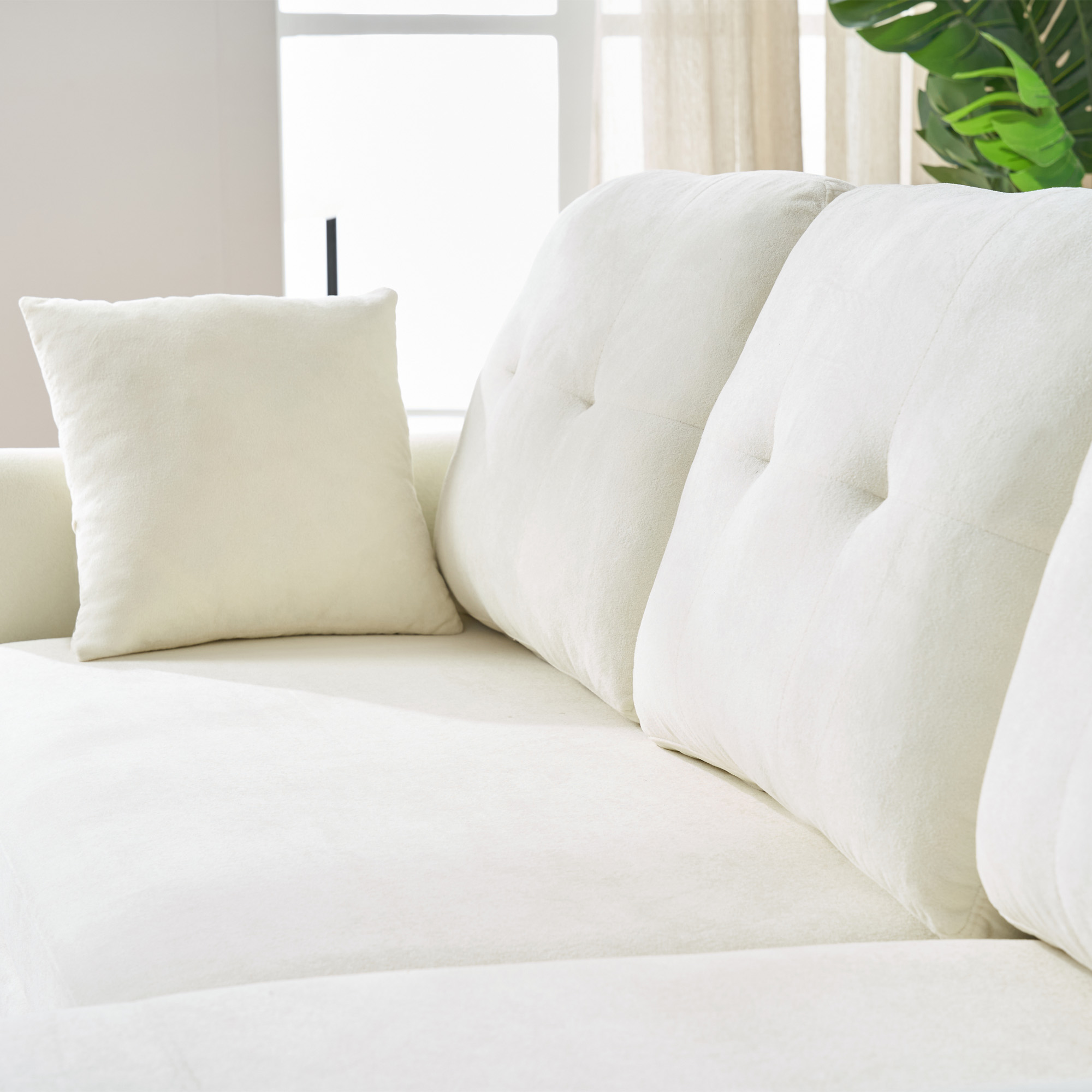 Canapé d'angle convertible en chenille beige, structure en U avec coffre de rangement intégré, assise profonde 109cm, idéal salon ou chambre d'amis, dimensions totales 206x130x85cm.